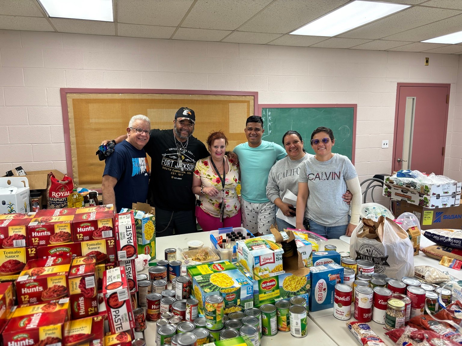 Neighbors and volunteers serving through Project Exartizo